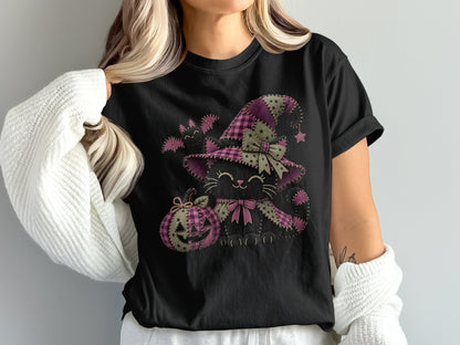 Black t-shirt featuring a patchwork Halloween cat wearing a witch hat next to a jack-o'-lantern.