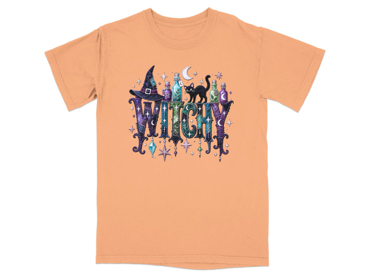 Orange t-shirt with "Witchy" text and Halloween-themed graphic.
