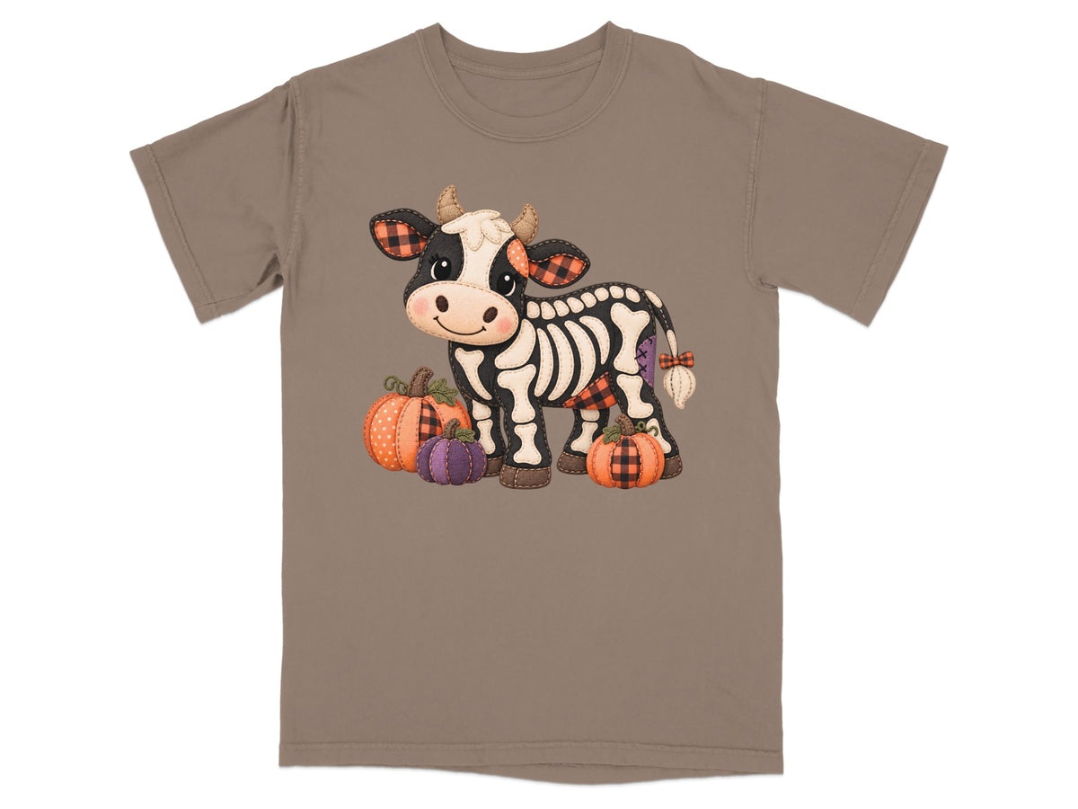 Skeleton cow with pumpkins on brown t-shirt.