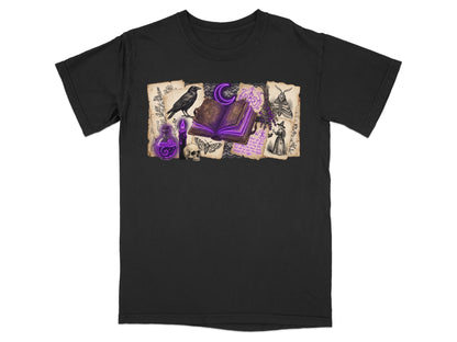 Black t-shirt with witchy illustrations of a raven, open book, skull, and potion.