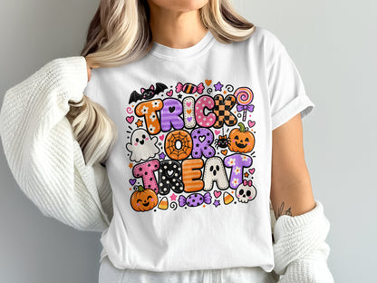 White t-shirt with "Trick or Treat" text and Halloween graphics.