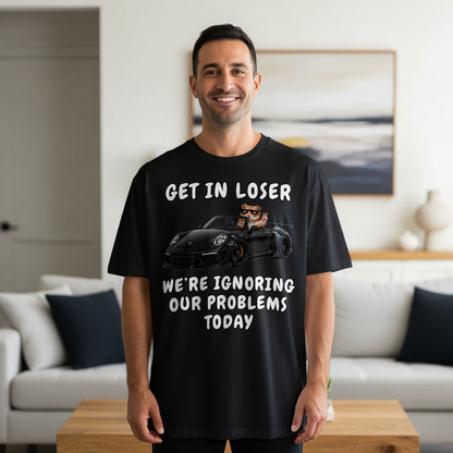 Black t-shirt with text and image of a cat driving a car.