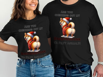 Black t-shirts with a cartoon Shiba Inu wearing a Santa hat and ugly sweater.