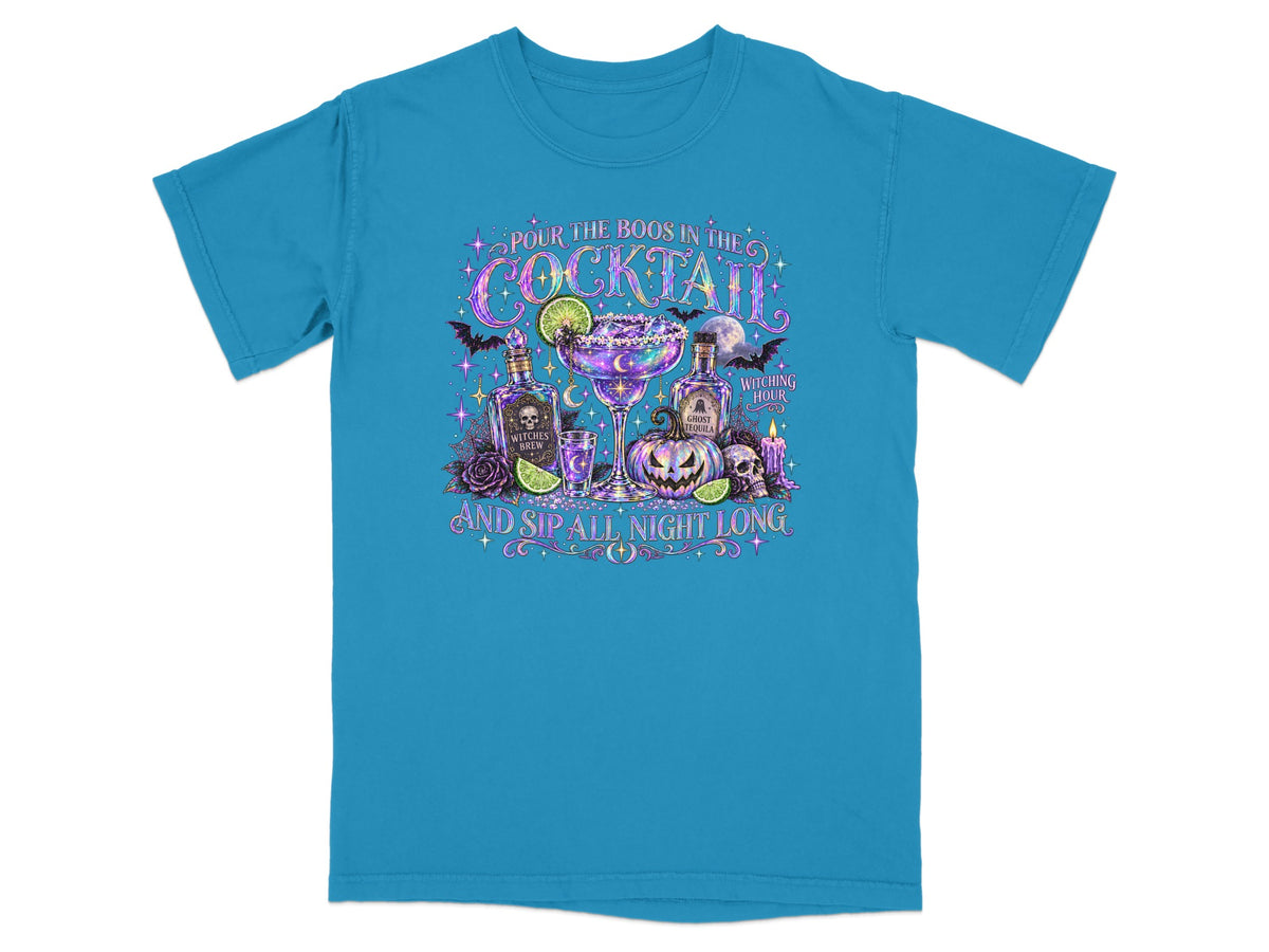 Teal t-shirt with "Pour the boos in the cocktail and sip all night long" text and Halloween graphics.
