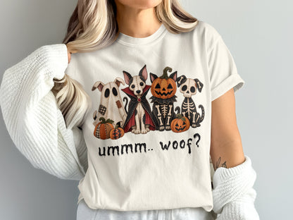 Dogs in Halloween costumes: ghost, vampire, skeleton, with pumpkins and text "ummm.. woof?".