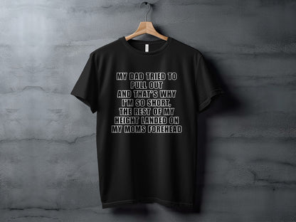 Black t-shirt with "My dad tried to pull out" text.
