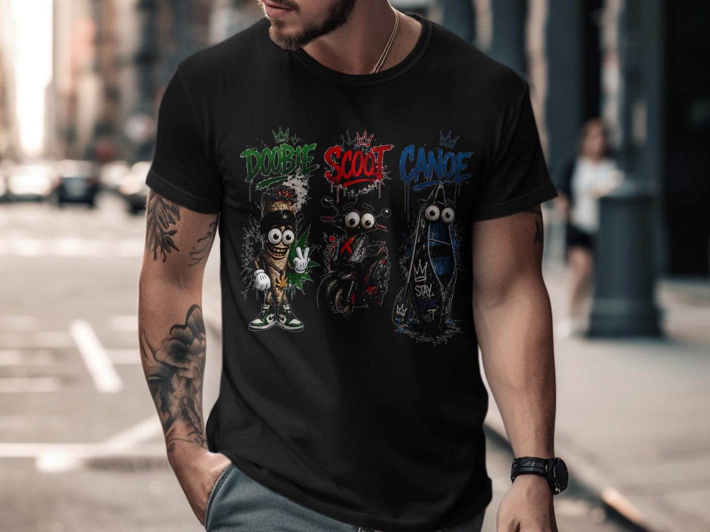 Black t-shirt with "Doobie," "Scoot," and "Canoe" graphics featuring cartoon characters and vehicles.