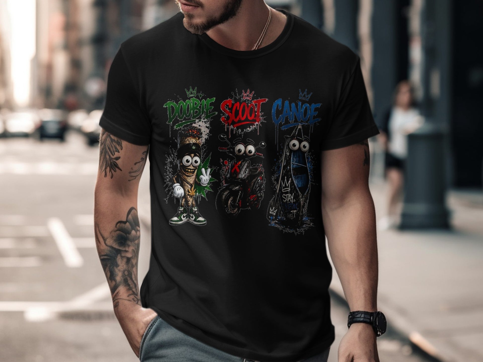 Black t-shirt with "Doobie," "Scoot," and "Canoe" graphics featuring cartoon characters and vehicles.