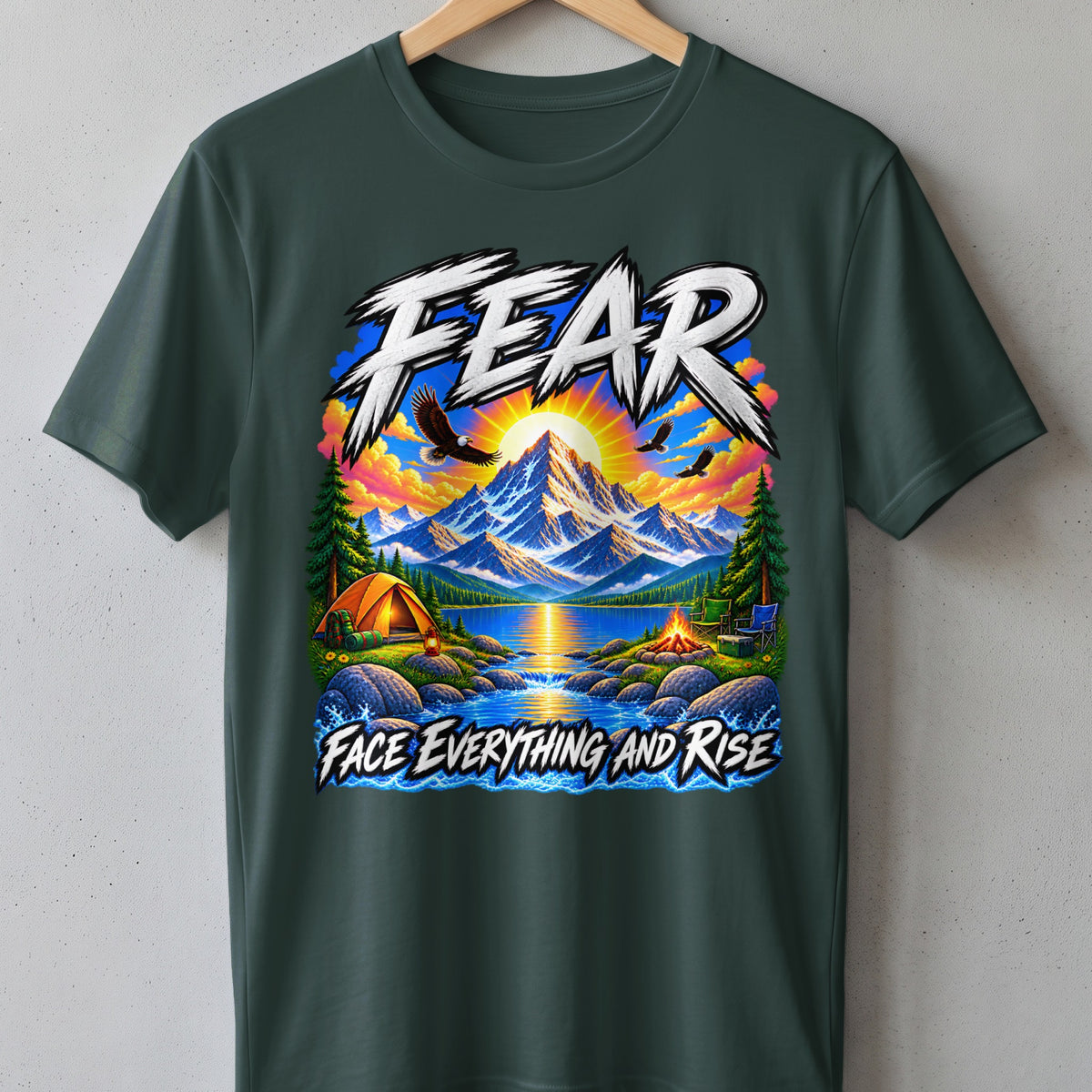 T-shirt with "FEAR FACE EVERYTHING AND RISE" text, mountains, lake, tent, and eagles.