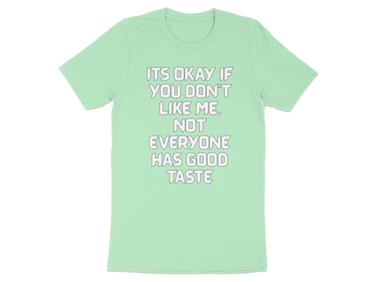 Mint t-shirt with white text "ITS OKAY IF YOU DON'T LIKE ME. NOT EVERYONE HAS GOOD TASTE."