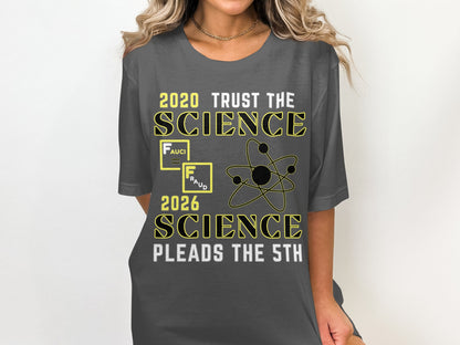 Dark gray t-shirt with text "2020 TRUST THE SCIENCE" and "2026 SCIENCE PLEADS THE 5TH".