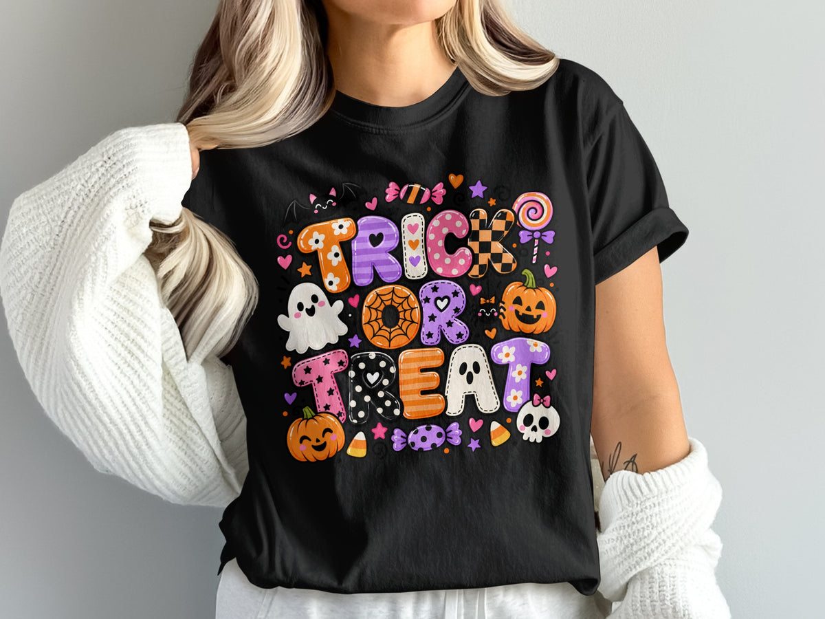 Black t-shirt with "Trick or Treat" text and Halloween graphics.