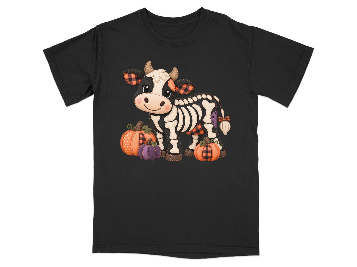 Black t-shirt with skeleton cow and pumpkins graphic.