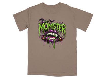 Brown t-shirt with a graphic of dripping green "MOMSTER" text over purple lips and fangs.