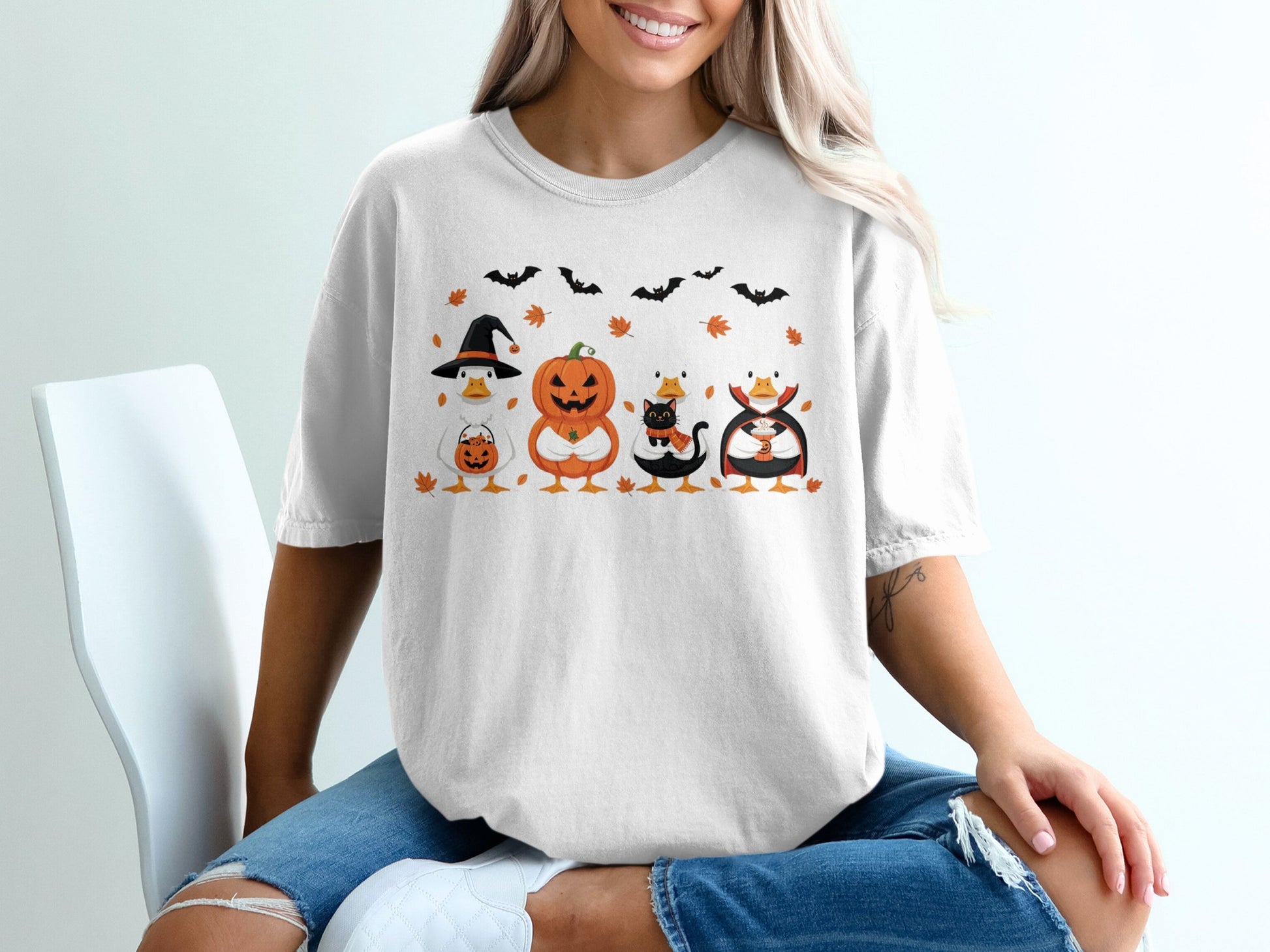 Halloween ducks wearing costumes and holding candy and drinks, with bats and leaves.