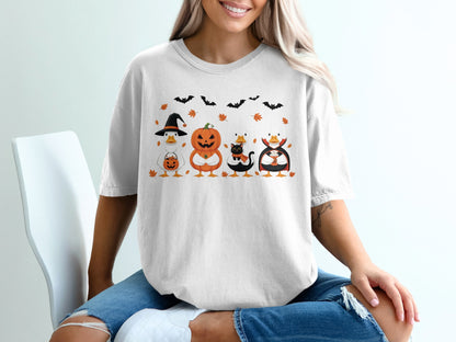 Halloween ducks wearing costumes and holding candy and drinks, with bats and leaves.