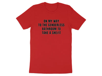 Red t-shirt with black text that reads "ON MY WAY TO THE GENDERLESS BATHROOM TO TAKE A SHE/IT".