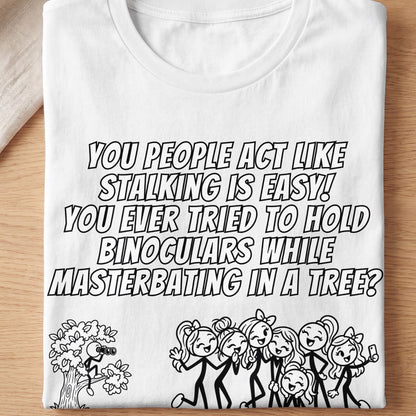 White t-shirt with text and cartoon figures about stalking and binoculars.