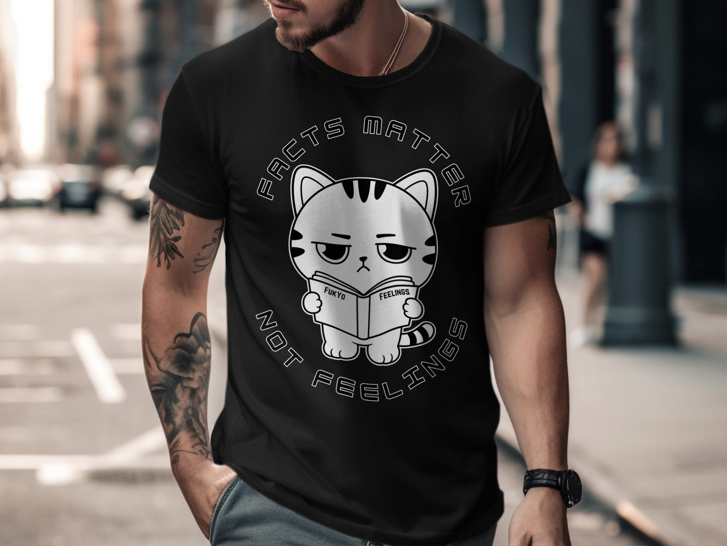 Black t-shirt with a cartoon cat reading a book that says "Facts Matter Not Feelings".