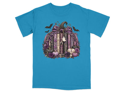 Pumpkin with books, bats, roses, and a ghost charm on a teal t-shirt.