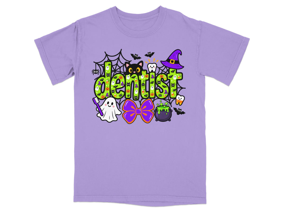 Light purple t-shirt featuring a green polka-dot "Dentist" graphic surrounded by Halloween elements.