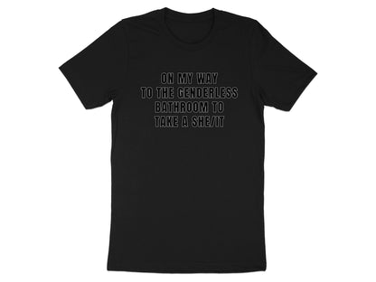 Black t-shirt with white text: ON MY WAY TO THE GENDERLESS BATHROOM TO TAKE A SHE/IT