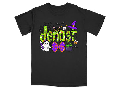 Black short-sleeved t-shirt featuring a green Halloween-themed graphic that spells the word dentist, surrounded by bats, a ghost, and a cauldron.