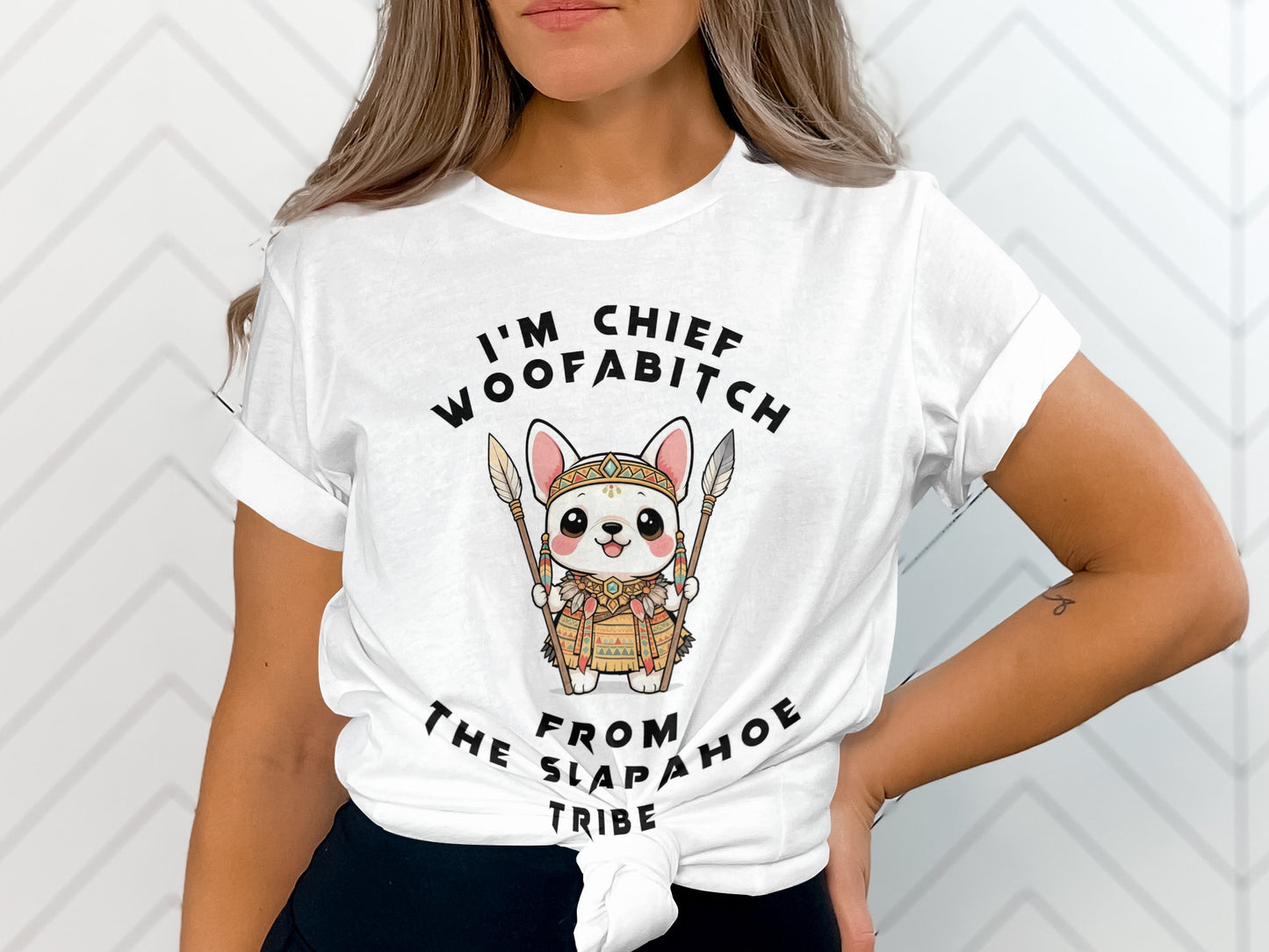 White t-shirt with cartoon dog wearing tribal attire and text: I'm Chief Woofabitch From The Slapahoe Tribe.