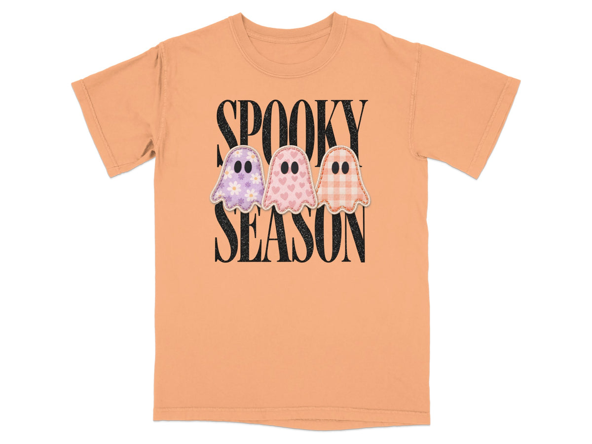 Orange t-shirt with "Spooky Season" and three decorated ghosts.