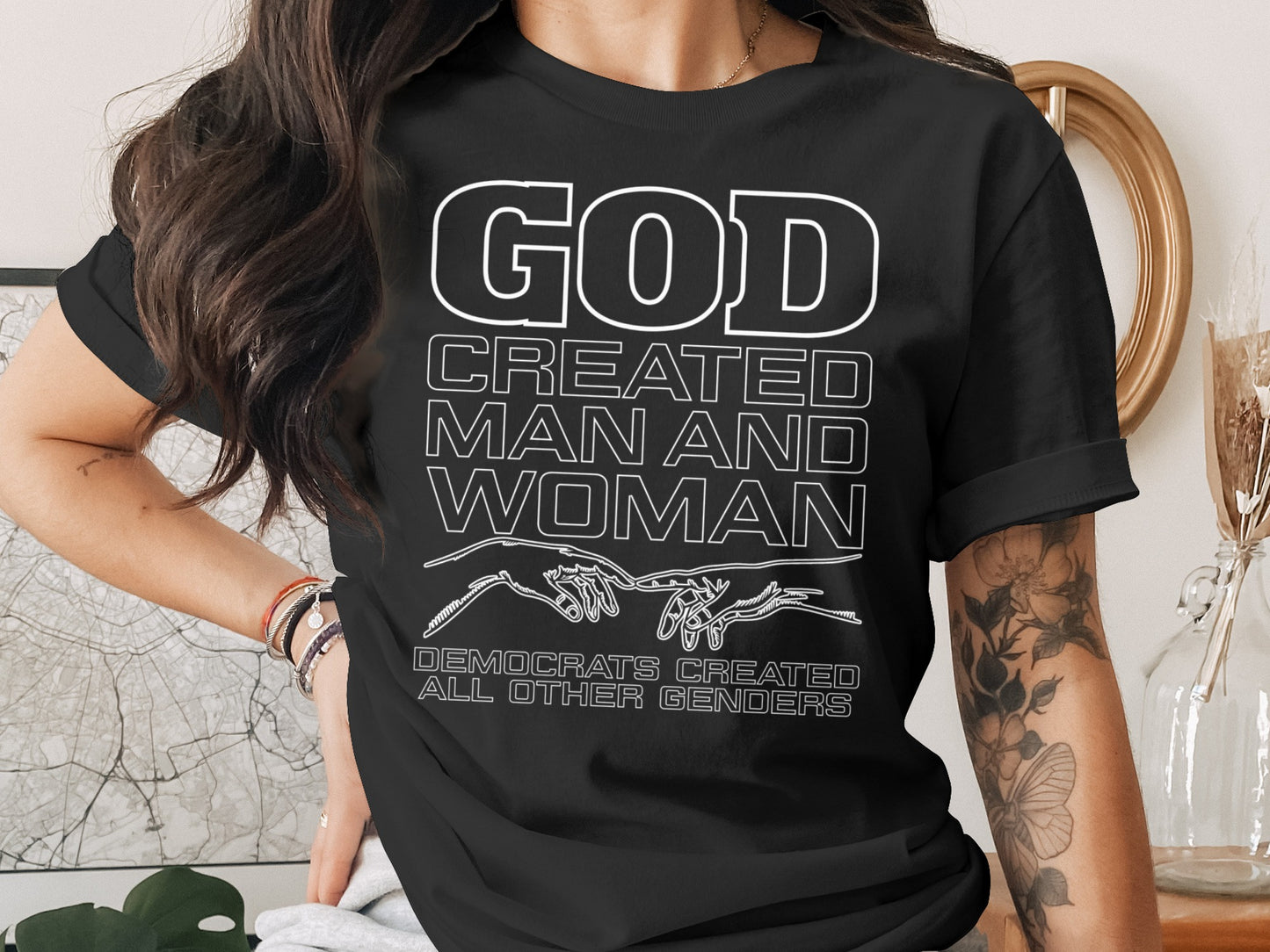 Black t-shirt with white text: God created man and woman. Democrats created all other genders.