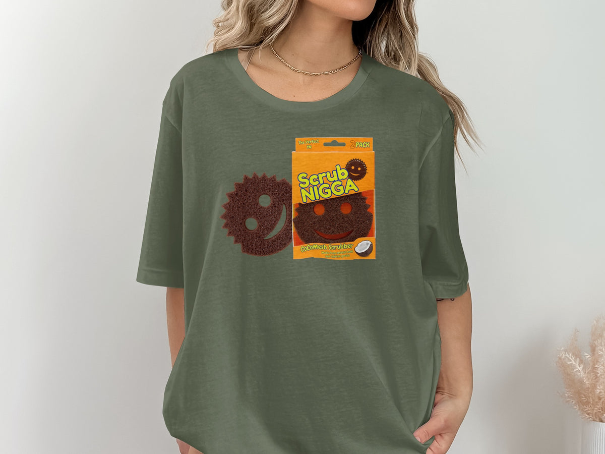 Two brown scrubbers, one in packaging labeled "Scrub Nigga", on green t-shirt.