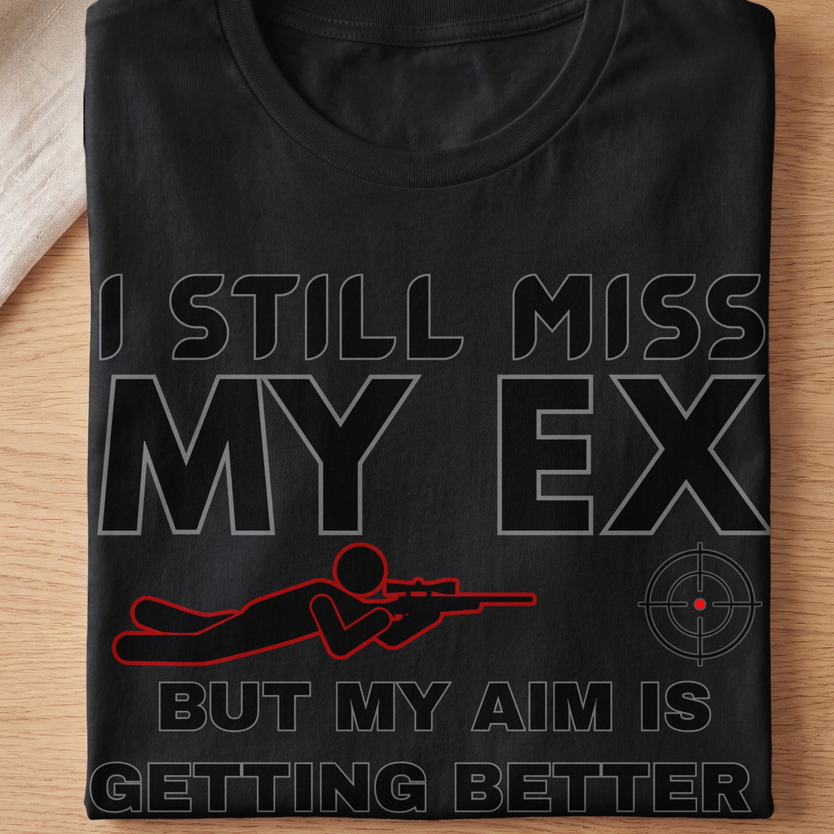 Black t-shirt with text "I STILL MISS MY EX BUT MY AIM IS GETTING BETTER".