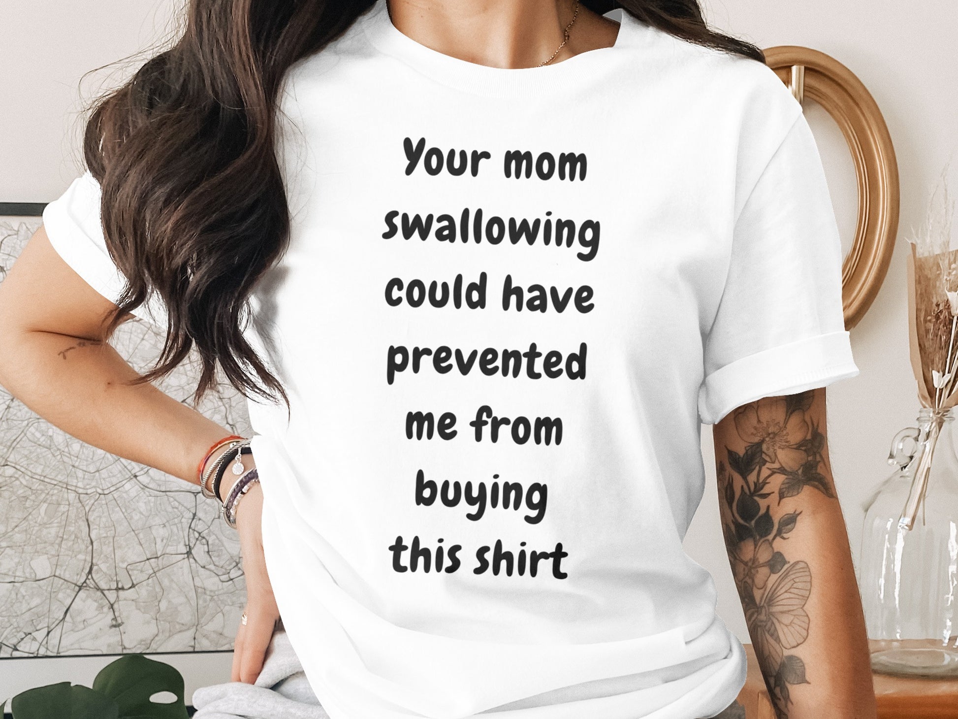 White t-shirt with black text reading "Your mom swallowing could have prevented me from buying this shirt."