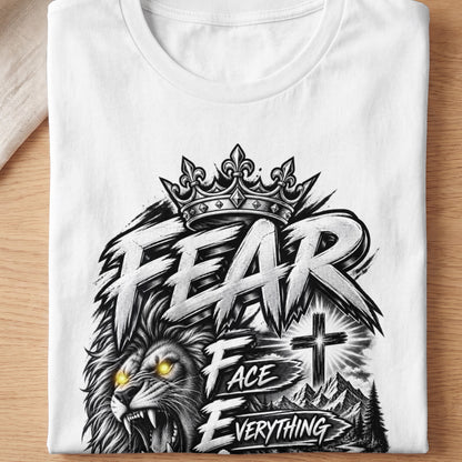 White t-shirt with a graphic of a lion's head, crown, and the words "FEAR FACE EVERYTHING".