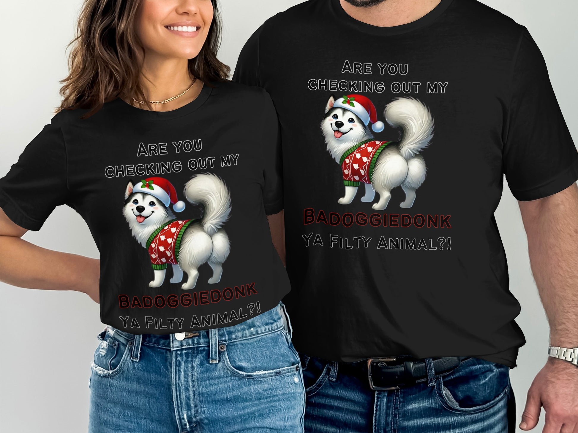 Black t-shirts with husky wearing Santa hat and sweater, "Are You Checking Out My Badoggiedonk" text.