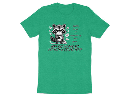 Green t-shirt with a grumpy raccoon holding a shovel and text.