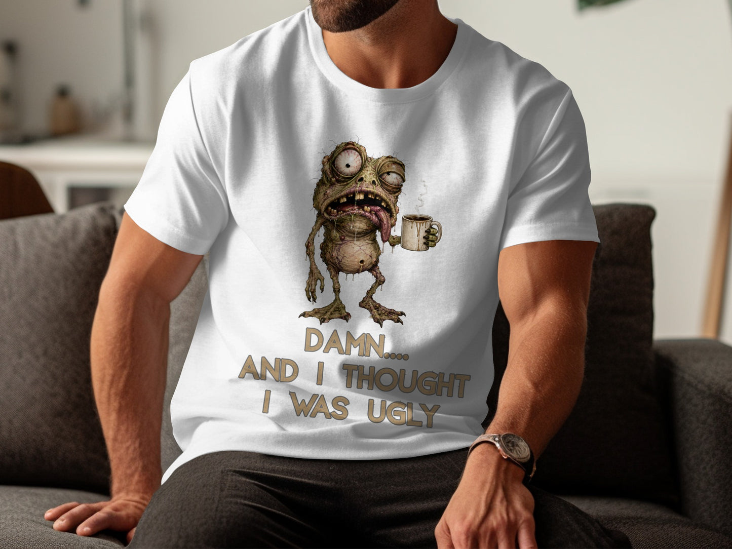 T-shirt with cartoon monster holding coffee mug and text "Damn.... And I thought I was ugly."