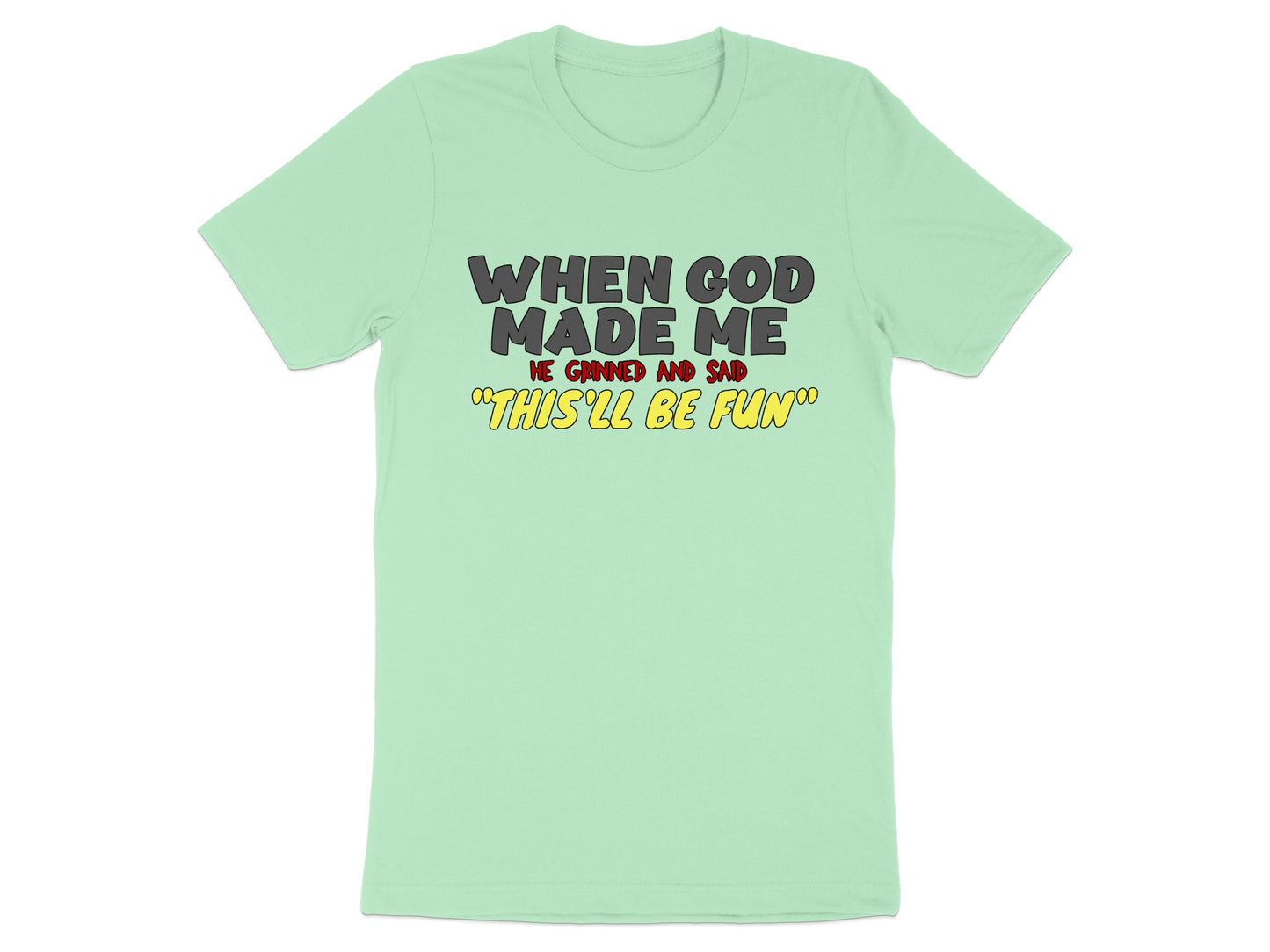 Light green t-shirt with text "When God Made Me He Grinned And Said 'This'll Be Fun'".