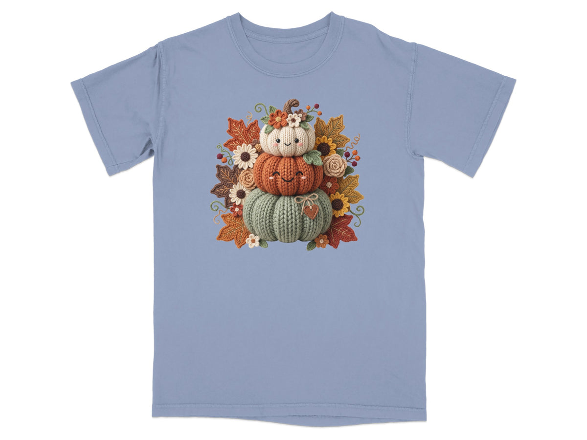 T-shirt with a stacked pumpkin design featuring autumnal flowers and leaves.