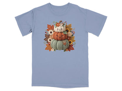 T-shirt with a stacked pumpkin design featuring autumnal flowers and leaves.