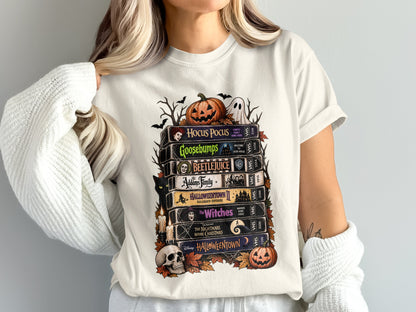 Stack of Halloween movie VHS tapes featuring Hocus Pocus, Beetlejuice, and Tim Burton's The Nightmare Before Christmas.