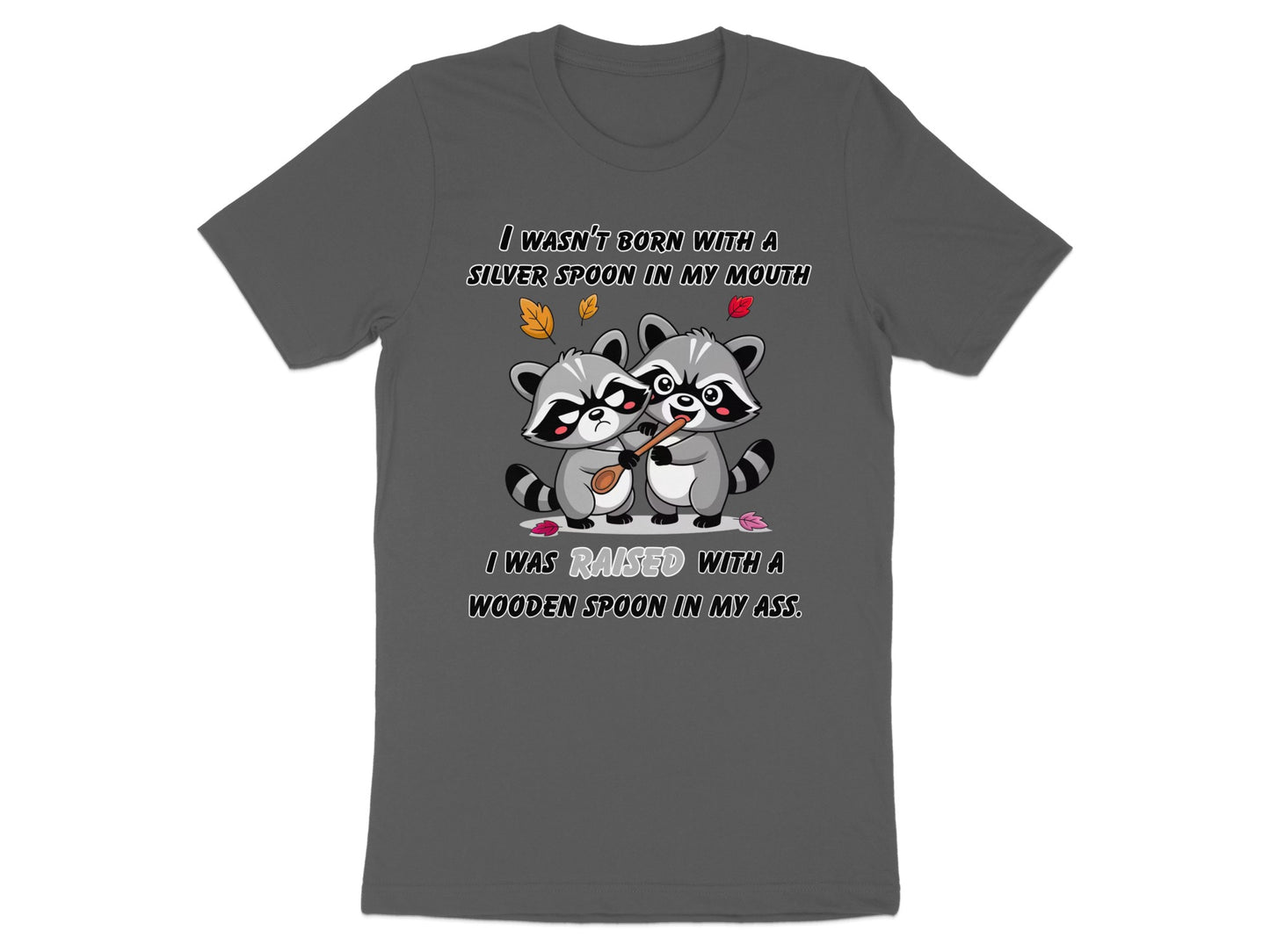 Two raccoons with text "I WASN'T BORN WITH A SILVER SPOON IN MY MOUTH I WAS RAISED WITH A WOODEN SPOON IN MY ASS."