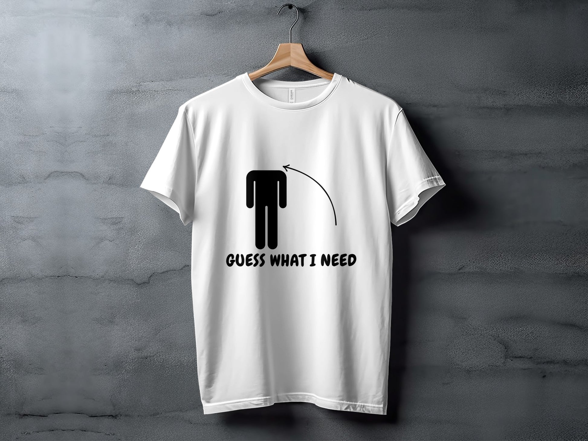 White t-shirt with black graphic of a headless figure and text "GUESS WHAT I NEED".