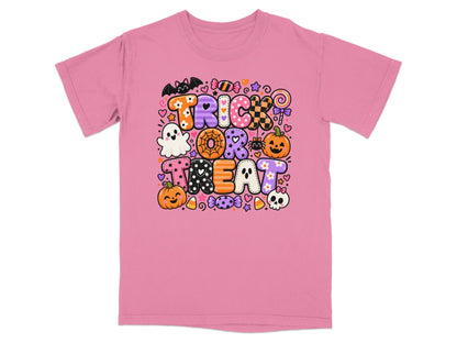 Pink t-shirt with "Trick Or Treat" Halloween graphic featuring ghosts, pumpkins, and candy.
