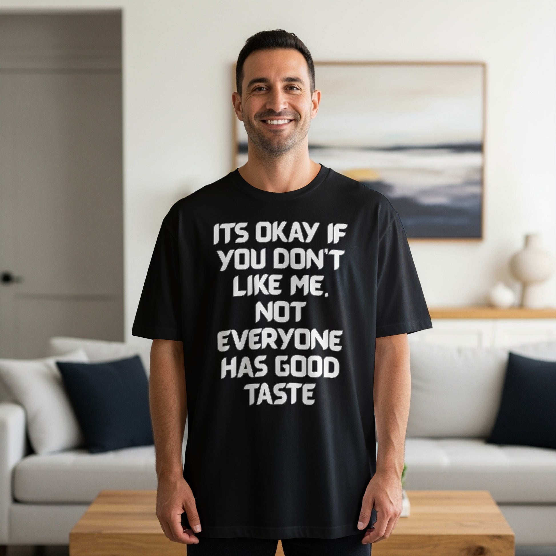 Black t-shirt with white text that says "It's Okay If You Don't Like Me. Not Everyone Has Good Taste."