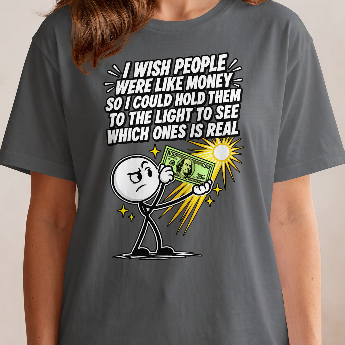 Stick figure holds a hundred-dollar bill to the light with the text "I wish people were like money".