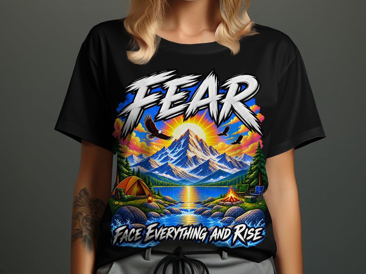 Black t-shirt with "FEAR FACE EVERYTHING AND RISE" and mountain landscape graphic.