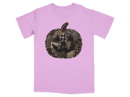 Pink t-shirt with a patchwork jack-o'-lantern design.