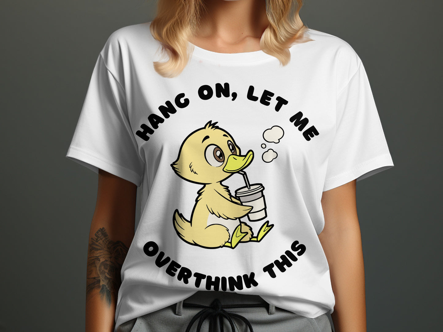 White t-shirt with cartoon duck drinking from a cup, reading "Hang on, let me overthink this."