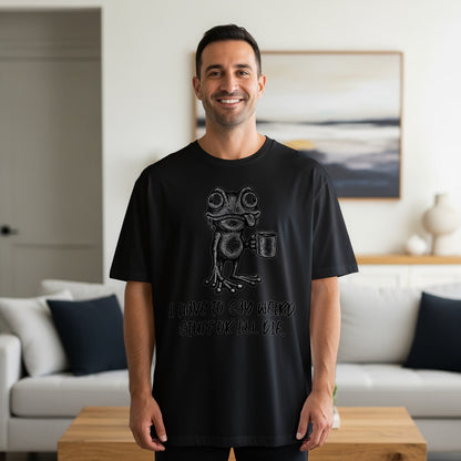 Black t-shirt with a cartoon frog holding a mug and the text "I HAVE TO SAY WEIRD STUFF OR I'LL DIE."